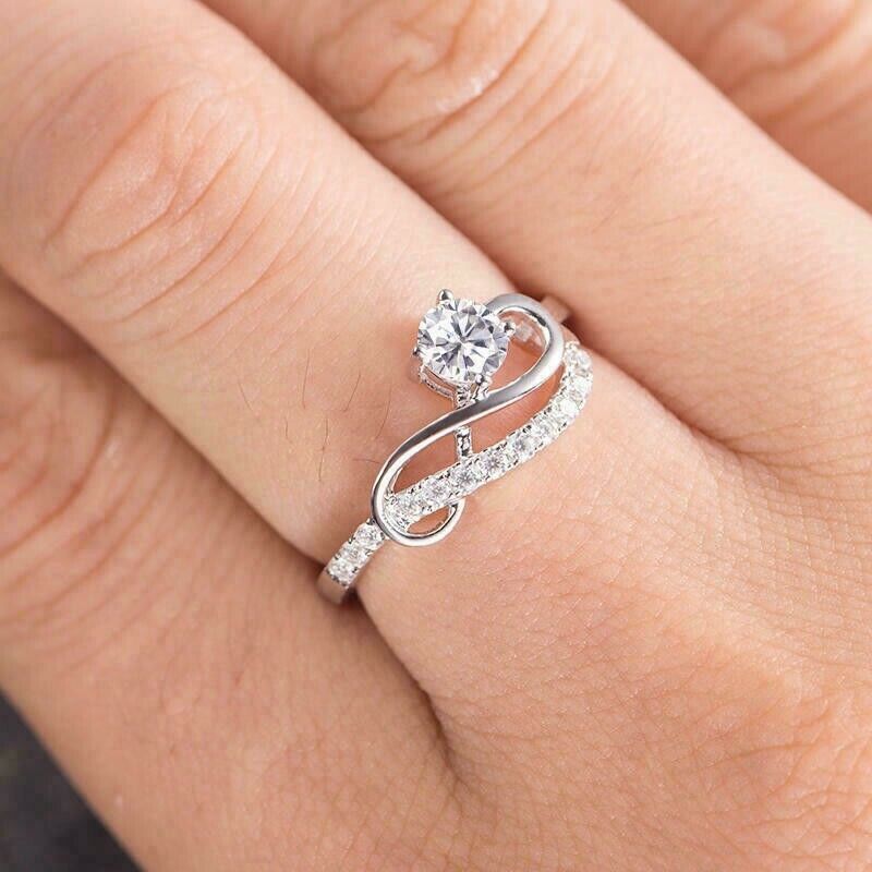 Anello Vague Infinita in moissanite e oro bianco