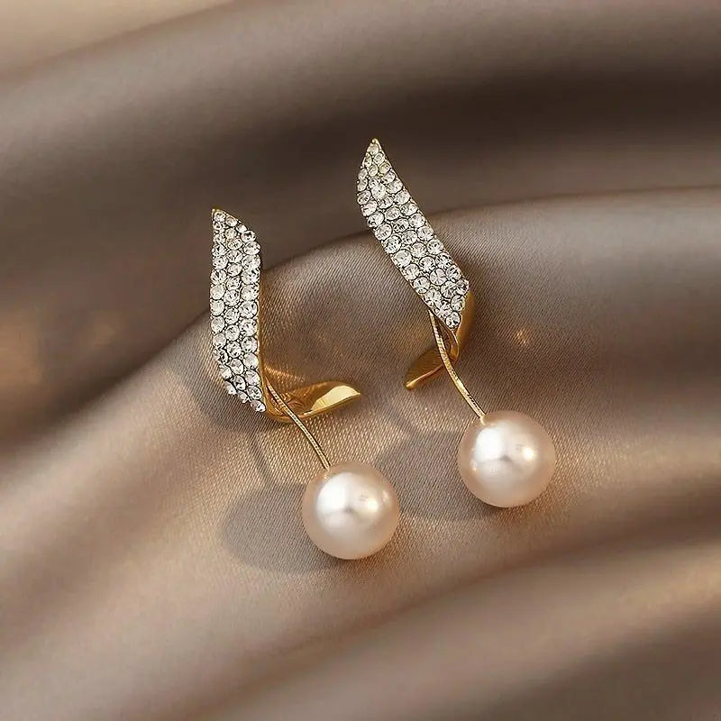 Orecchini in oro con perle