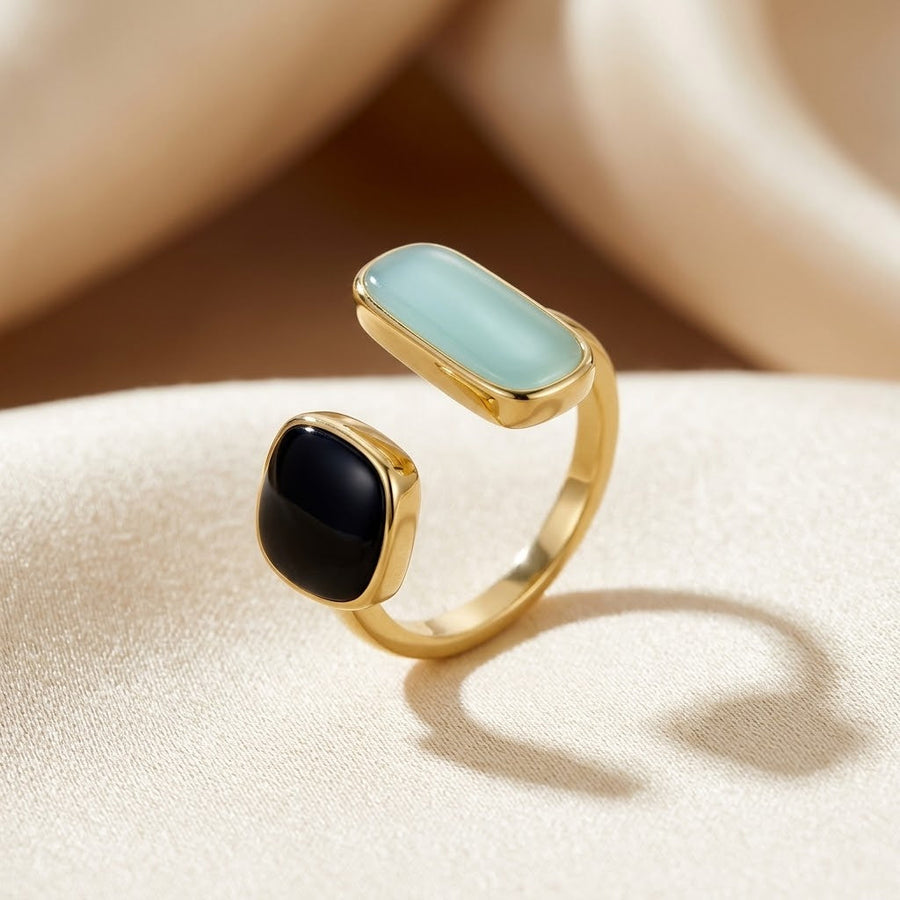 Anello aperto in oro con due pietre